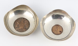 A pair of silver coin set dishes Birmingham 1962 and 1963, gross weight 264 grams, 9cm