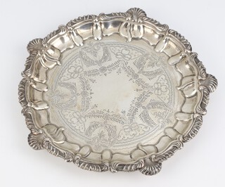 An Edwardian silver engraved salver with shell and scroll rim on bun feet, Birmingham 1909, 256 grams, 20cm 