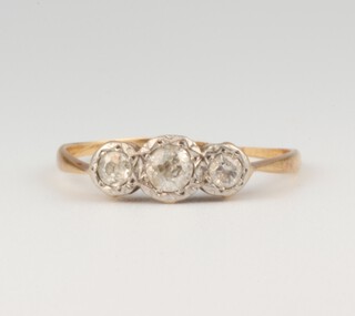 An 18ct yellow gold 3 stone diamond ring, 1.4 grams, approx. 0.3ct, size N, 1.4 grams 