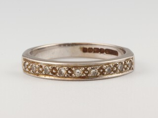 An 18ct white gold half eternity ring, approx. 0.10ct, size M 1/2. 3.5 grams 