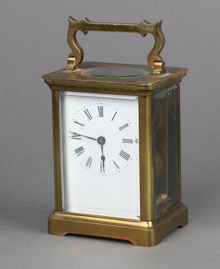 A 19th/20th Century carriage timepiece with 5cm enamelled dial, Roman numerals, contained in a gilt metal case 10cm h x 8cm w x 6cm d, complete with integral key and part leather carrying case 