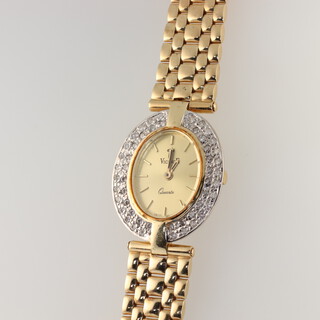 A lady's 14ct yellow gold diamond set wristwatch the dial inscribed Vicence with a quartz movement, the bezel set with brilliant cut diamonds (50), the case 25mm x 30mm, 41.5 grams including the glass 