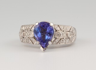 A white gold, testing as 14ct, tanzanite and diamond ring, the tear cut centre stone 2.3ct, the brilliant cut diamonds 0.4ct, size P, 7.4 grams 