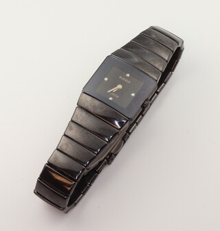 A lady's Rado black Jubile ceramic watch with diamonds at 12, 3, 6 and 9, the case numbered 153.0337.3, with ceramic bracelet, contained in a 20mm case, with original box 