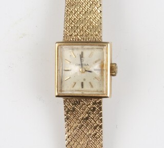 A lady's Omega 9ct yellow gold wristwatch with 15mm case, gross weight including glass 22.7 grams 