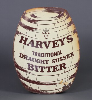 A "Harveys Tradition Draught Sussex Bitter" cream and brown enamelled advertising sign in the shape of a barrel 61cm x 47cm 