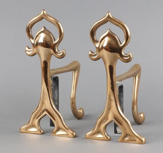 A pair of Art Nouveau polished brass and steel fire dogs 23cm x 17cm x 12cm 