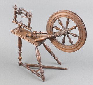 A 19th Century turned mahogany miniature spinning wheel  33cm x 36cm x 20cm