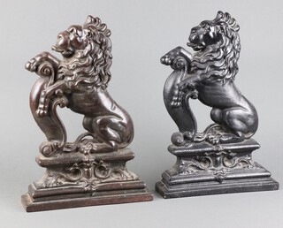 Two Victorian cast iron door stops in the form of rampant lions 38cm h x 25cm w x 27cm d