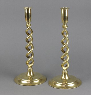 A pair of brass spiral turned candlesticks 31cm h x 13cm x diam. to base 