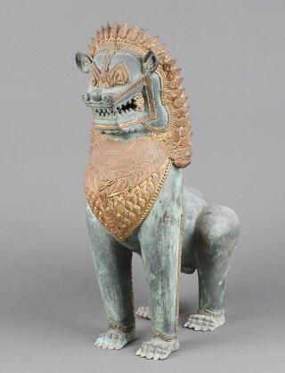 A 20th Century bronze and gilt embellished figure of a seated Dog of Fo 41cm h x 19cm w x 18cm d 