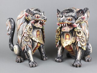 An impressive pair of 19th/20th Century carved wooden and painted figures of seated Dogs of Fo 40cm h x 26cm w  x 31cm d 