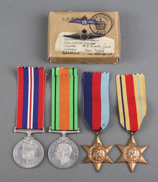 A group of 4 Second World War medals attributable to 565023 Flight Sergeant T Smith Royal Airforce comprising 1939-45 Star, Africa Star, Defence and War medal together with 2 sweetheart brooches in original posting box 