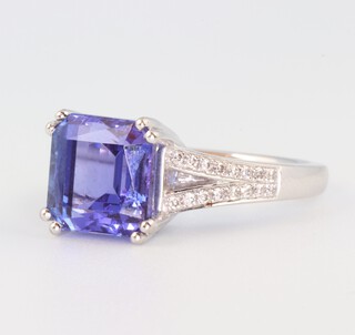 An 18ct white gold square cut tanzanite and diamond ring, the centre stone 5ct, the brilliant cut diamonds 0.2ct, size M 1/2  7.2 grams 