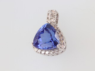 A white gold, testing as 10ct, tanzanite and diamond pendant, the centre stone 10ct, the brilliant cut diamonds approx. 1ct, 6 grams, 23mm 