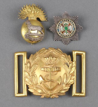 A Victorian Naval officer's belt buckle, an Irish Guards officer's collar dog converted to a sweetheart brooch and a Royal Munster Fusileers cap badge 