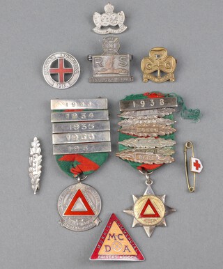 Two silver safe driving medals, a Sterling and enamelled badge Regina Hospital 1913, Morris Commercial Driver's enamelled badge and 4 other badges 