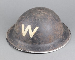 A Second World War Air Raid Warden's steel helmet complete with liner 