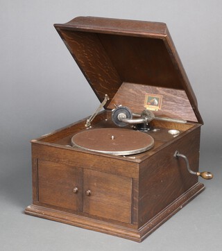 His Master's Voice, a gramophone complete with handle contained in an oak case 35cm h x 45cm w x 37cm d 