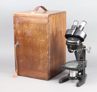 A Watson no.119303 binocular microscope, complete with carrying case 