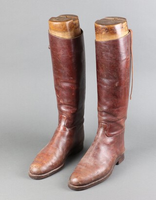 A pair of brown leather riding boots complete with trees, approx. size 8 