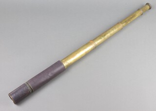 A brass 4 draw telescope with leather covering 