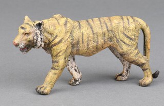 An Austrian style cold painted bronze figure of a walking tiger 5cm x 10cm 