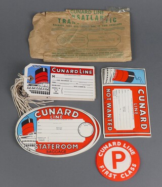 Cunard - 12 rectangular luggage labels, 21 oval State Room baggage labels, 11 rectangular Not Wanted on Voyage labels and 12 circular key First Class labels 