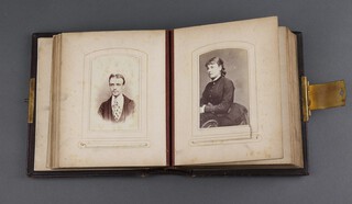 A Victorian leather bound photograph album containing 38 black and white portrait photographs 