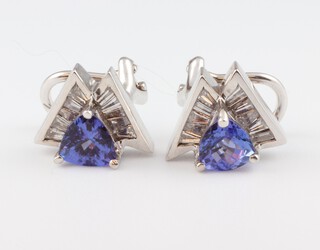 A pair of 14ct white gold tanzanite and diamond earrings, the triangular cut tanzanites approx. 1ct, the tapered baguette cut diamonds 0.04ct, 5.6 grams, 12mm 