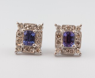 A pair of white gold, testing as 9ct, tanzanite and diamond rectangular ear studs, the tanzanite 0.6ct, the diamonds 0.2ct, 8mm 3 grams