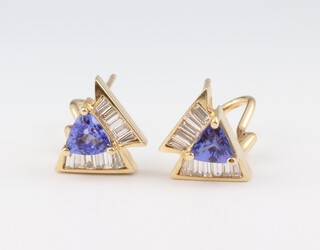 A pair of yellow gold, testing as 14ct, tanzanite and diamond ear studs, the triangular tanzanites approx. 1.2ct, the tapered baguette diamonds 0.5ct, 12mm, 5.4 grams 