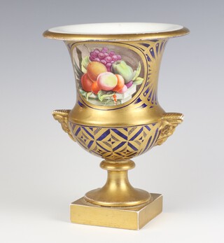 A 19th Century Paris porcelain urn shaped vase with panels of fruits and flowers, having mask handles on a square gilt base 20cm 