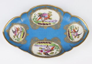 A 19th Century Sevres quatrefoil dish, the pale blue ground with 4 panels of exotic birds 29.5cm 