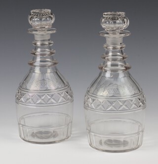 A pair of 19th Century 3 ring neck mallet shaped decanters and stoppers with hobnail decoration 24cm 