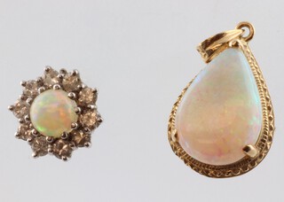 A yellow gold heart shaped opal pendant 1.2 grams together with a white gold opal and diamond ear stud, the opal 0.5ct, diamonds 0.2ct, 1.3 grams