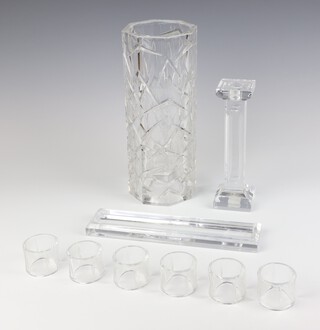 A Stewart Crystal glass dry plant holder 28cm, 6 Louise Kennedy glass napkin rings, a glass candlestick and pen tray 