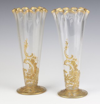 A pair of Art Nouveau gilt decorated tapered vases decorated with scrolls, flowers and shells 26cm  