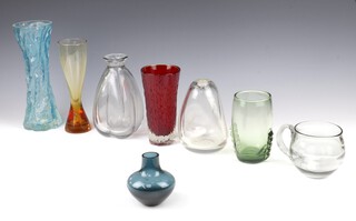 A Whitefriars squat blue vase 9cm, a Whitefriars cup 10cm, twin handled vase 14cm, a red bark finish vase 17cm, pale blue bottle 20cm, an amber vase 20cm, a turquoise vase 27cm  and a clear glass Liskeard bulbous vase 15cm.