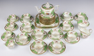 A Coalport tea set with cream ground decorated with spring flowers, comprising 4 coffee cups, 3 saucers, 11 tea cups (4 cracked and 1 riveted), 11 saucers (6 cracked), teapot (stuck finial), milk jug, sugar bowl, 12 side plates (1 cracked) 2 serving plates, all numbered 2665  