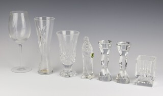 A Waterford Crystal Art Deco style square glass vase with stepped base 10cm, a pair of John Rocha Waterford candlesticks 15cm and a ditto wine glass, 2 vases and a figure 