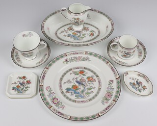 A Wedgwood Kutani Crane part tea, coffee and dinner service comprising 9 coffee cans, 6 large tea cups, 2 small tea cups, 12 saucers, 8 small plates, 8 side plates, 8 dessert bowls, 8 dinner plates, 2 oval vegetable dishes, 4 small dishes (1 a/f) and a cream jug  