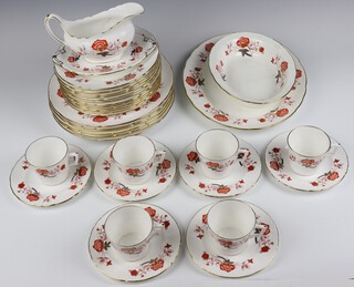 A Royal Crown Derby Bali pattern part coffee and dinner service comprising 6 coffee cups, 6 small plates, 12 side plates, 6 dinner plates, 1 oval meat plate, vegetable dish, sauce boat and stand (sauce boat a/f) 