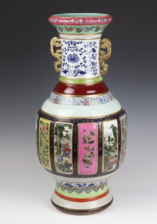 A modern Chinese baluster vase with panels of flowers, birds and trees with dragon handles 61cm 