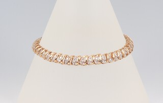 A 10ct yellow gold diamond set bracelet, 17cm, 8.2 grams