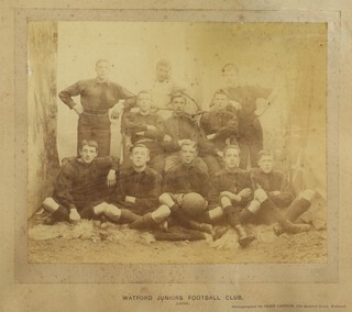 Of football interest, a photograph - Watford Juniors Football Club 1895, photograph by Jesse Landon, contained in a maple frame 23cm x 30cm 