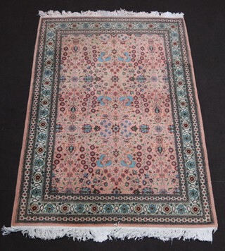 A pink and turquoise floral patterned Persian rug 197cm x 132cm 