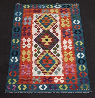 A white, orange and green ground Chobi Kilim rug with 3 diamonds to the centre 150cm x 100cm 