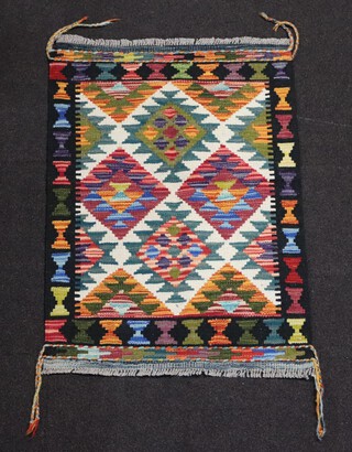 A white, green and orange ground Maimana Kilim rug with all over geometric design 87cm x 61cm 