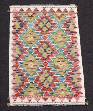 A white, turquoise and tan ground Chobi Kilim with overall geometric design 99cm x 62cm 